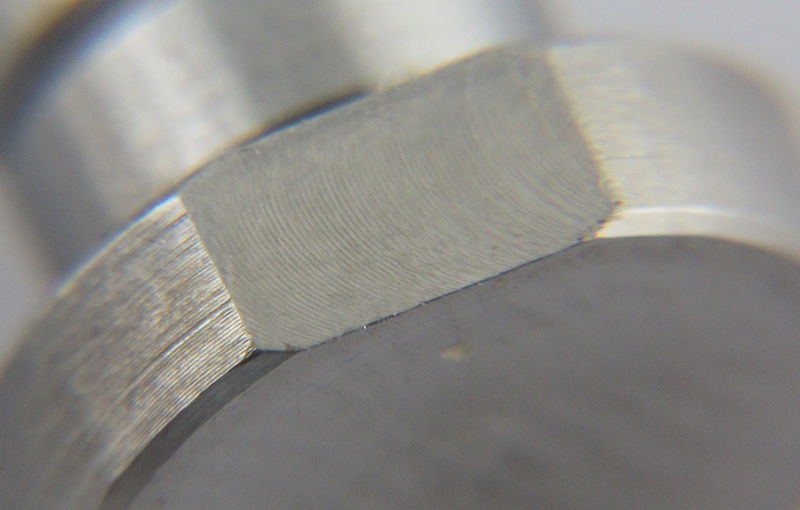 To mill the across flats and remove the burrs directly on a powerful CNC lathe machine.