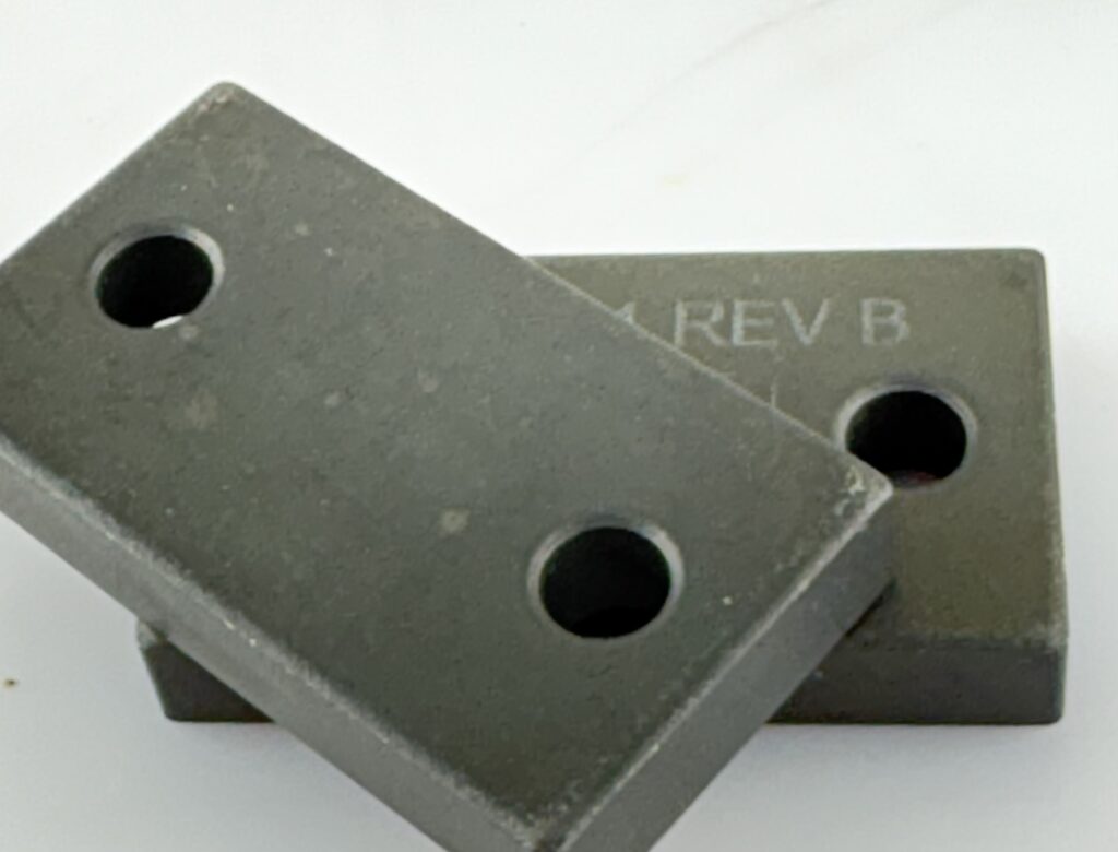 Flat bar made by Powder Metallurgy with letter engraving and black oxide finish