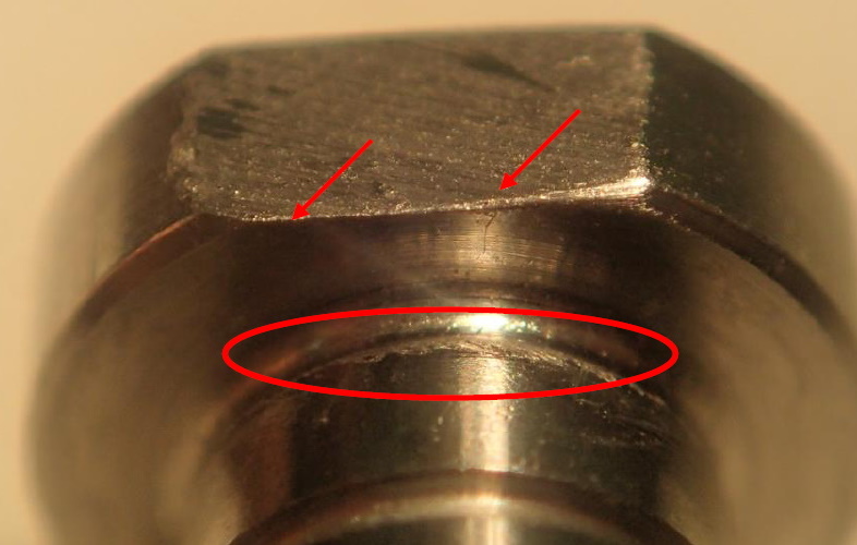The inconsistent force exertion led to the uneven chamfers marked by red arrows. The undercut marked by red circle is very rough due to the fact that the cutting tool is worn out.